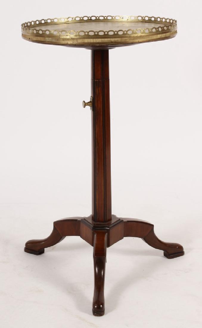 Louis XVI-Style Brass Mtd. Mahogany Adjustable Gueridon: Louis XVI-Style Brass Mtd. Mahogany Adjustable Gueridon, late 19th- e. 20th c.,marble top with brass gallery; on three legs terminating in pad feet. (MANDS3201){WK} Measurements:25 H x 14 Dia.