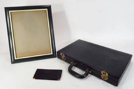 3 Mark Cross Leather Items: 3 Mark Cross leather itemsEasel back picture frame, attache case and wallet {CAPS5311/3} (PR) Dimensions: Frame 16.5"x 13.5" Provenance: Property from 201 Eeast 77th St. Manhattan, NYC