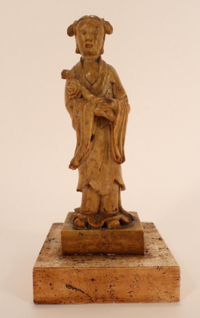 Chinese Soapstone Quan Yin: Chinese Soapstone Quan Yin, later 19th/Early 20th C. Delicately carved, incised floral design to clothing and base. Mounted on travertine plinth. {LCA7599} (WWT ) Dimensions: 9" x 3" x 2.25"