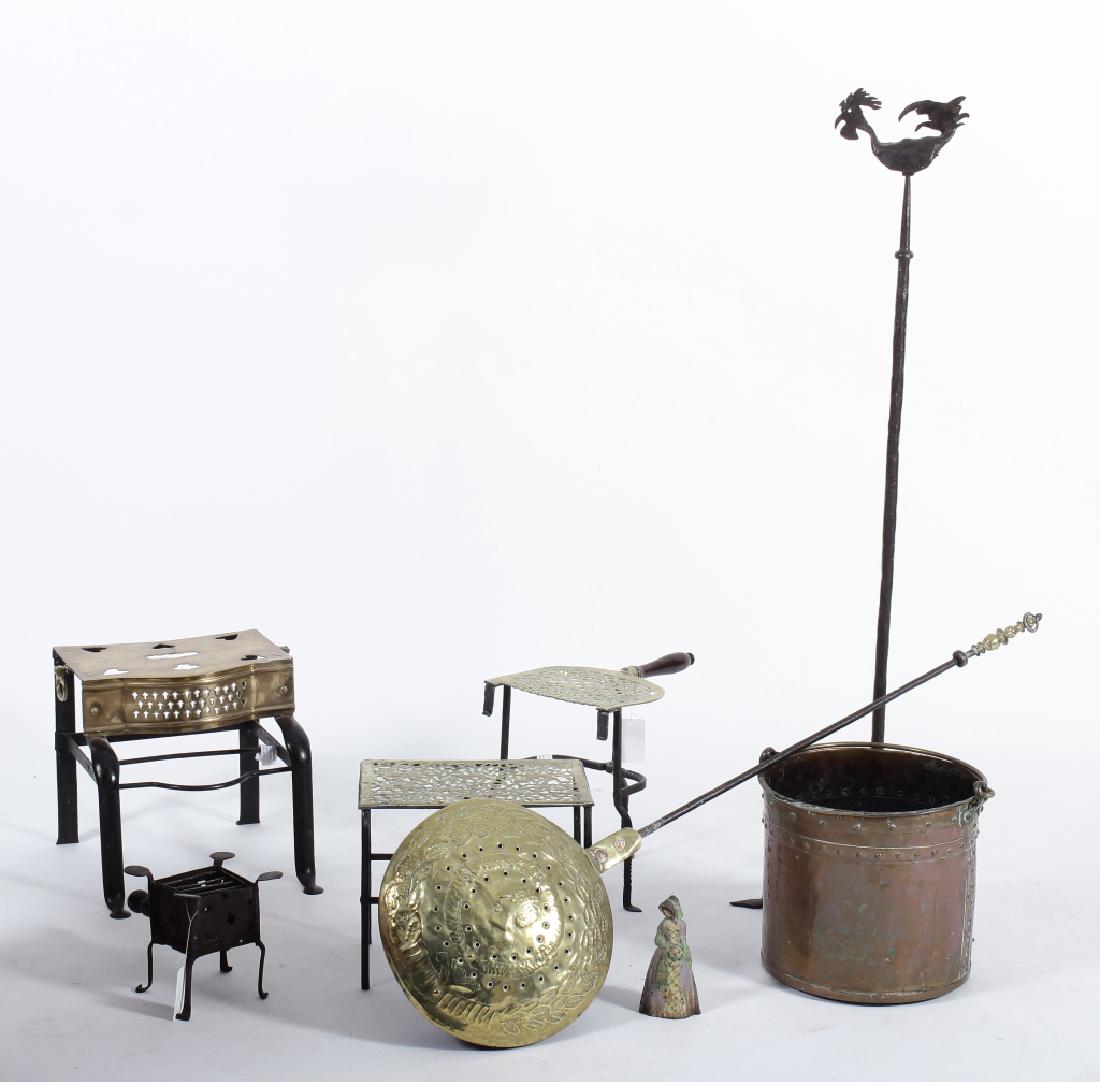 Group of 8 Metal Fireplace Objects, 19th-20th C.: Group of 8 Wrought Iron, Brass Mostly Fireplace Objects,19th-E. 20th C., includes trivets, bed warmer, hammered copper pot, pricket with decorative rooster cap and a figural painted doorstop. Biograph