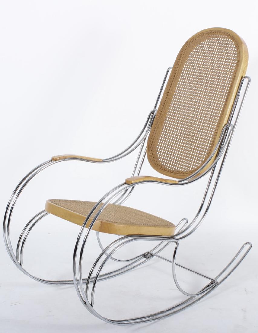 Chromed Steel and Cane Modernist Rocker: A chromed steel and caned Modernist rocker in the manner of Breuer, unusually heavy and rigid double tubular chromed steel construction, unmarked, possibly Italian, (JTRE9050) [TC] Dimensions: At rest