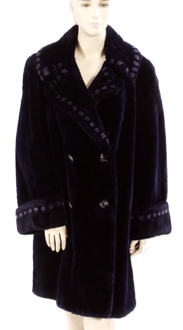 Dark Blue Sheared Fur Coat: Dark blue sheared (possibly mink) double breasted fur coat. Lighter blue fur square accents on collar, 4" cuffs, notched collar and front slip pockets. No label. NOTE: This lot is being re-auctioned d