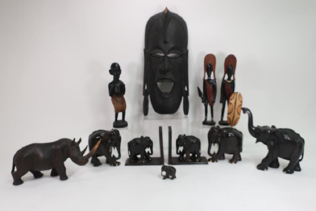 Lot of 11 African Ebony Carvings Elephants Figures: Lot of 11 African Ebony Wood & Ebonized Carvings: Elephants, figures and a large ebonized mask. Four carved ebony elephants and two elephant bookends, an ebonized carved wood rhinoceros and three ebon