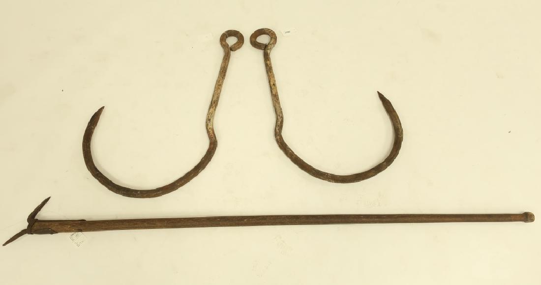 Iron Rustic Tools: Ice Pike and Pr. V. Large Hooks: A Gifford Wood Co ice harvesting pike pole tool with signed iron head on oak pole with knobbed end, together with a pair of very large wrought iron hooks terminating in a loop, possibly blubber hooks.