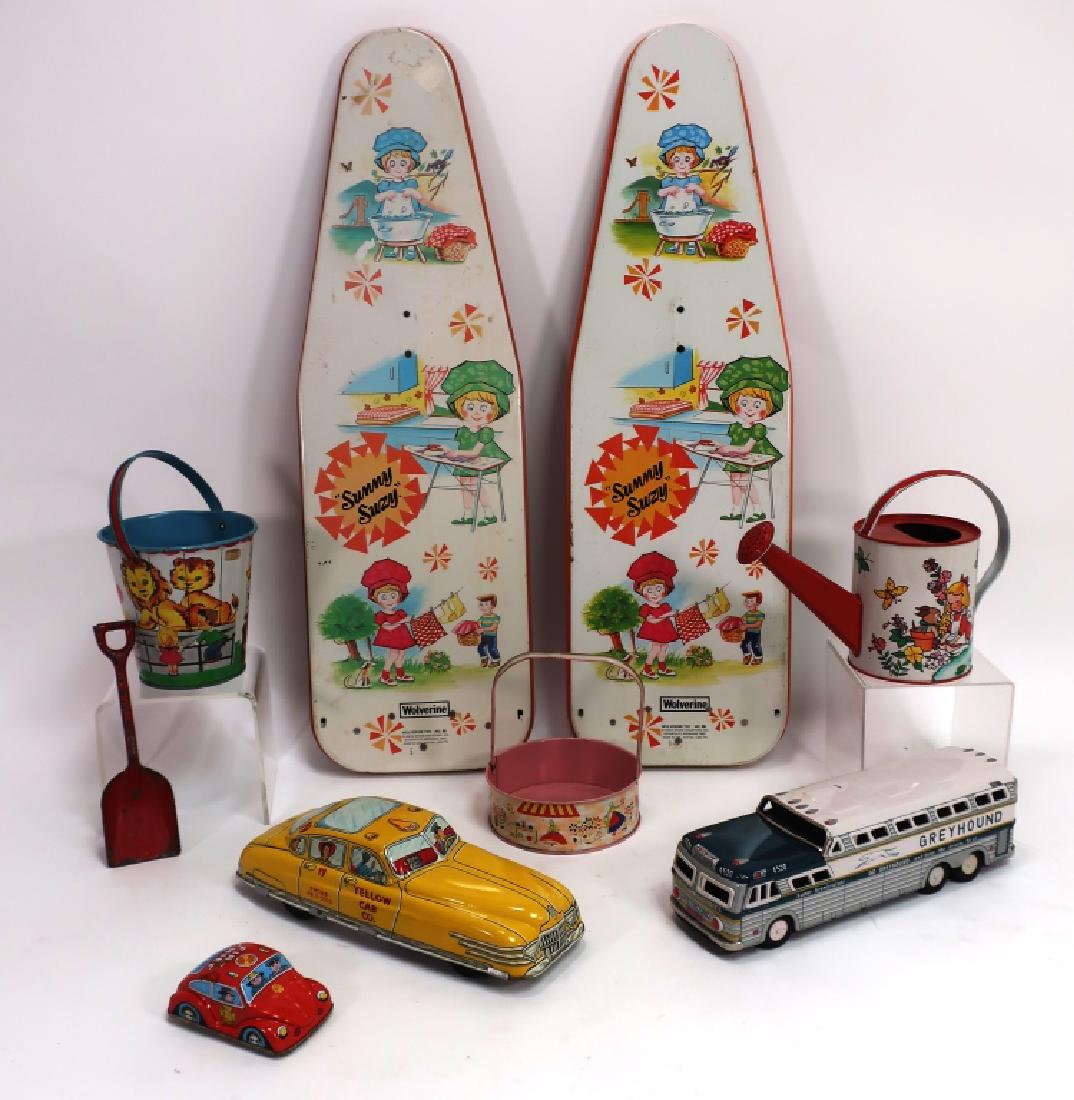 Lot of 8 Vintage Painted Tin Toys: Lot of 8 Vintage Painted Tin Toys, includes 2 Ironing Boards, Yellow Taxi, Greyhound Bus, Fire Chief Car, 2 Pails(one with shovel) and a watering can (APIN3100/8)(MM) Dimensions: Ironing board 28 x 8,