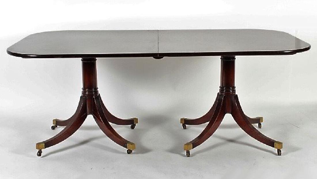 Georgian Style Mahogany Two Pedestal Dining Table: Georgian Style Mahogany Two Pedestal Dining Table w/ brass fitted feet on castors. Includes two 24" wide leaves in wood case and 94" oak supports for leaves. (QWET3415)(AC) Dimensions: 78" w x 45" d x