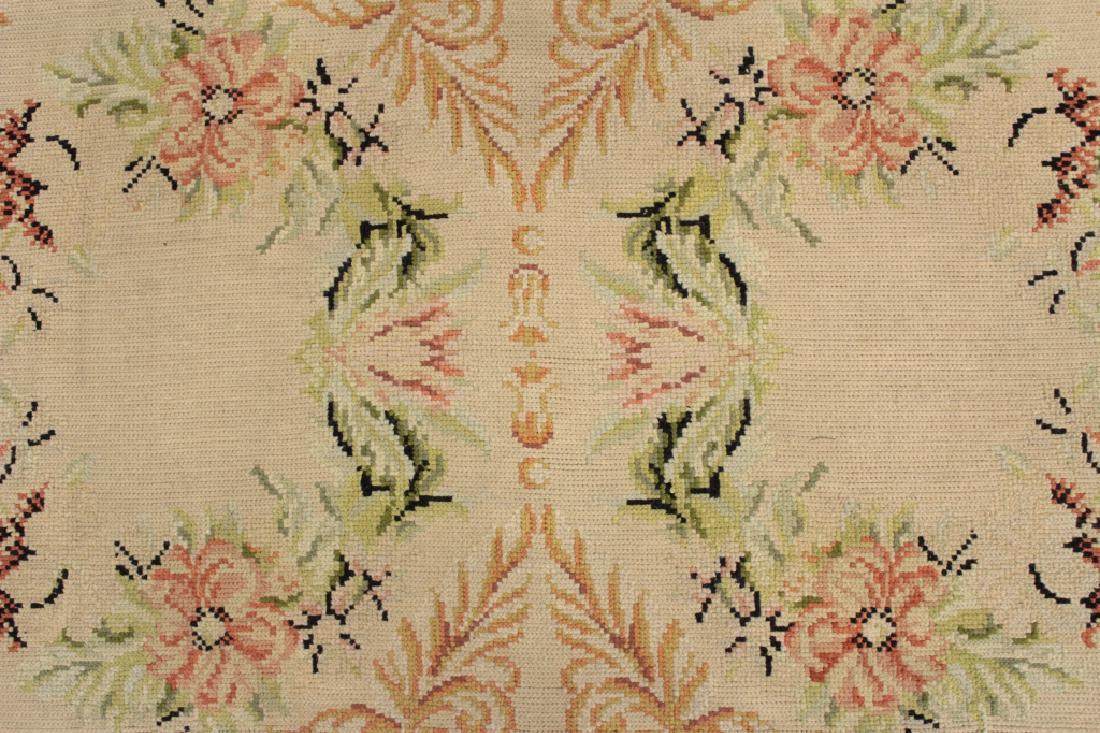 Stark Carpet, Made in Portugal: Needle work wool face. White ground. Salmon filled border. Floral and scroll motif. (QWET3710)(JM) Dimensions: 10' x 14' 2" Provenance: From the Estate of Deborah Wetzler, East 57th Street, NYC. A pri