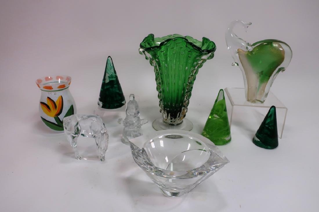 Lot of 9 Decorative Glass Items, incl. Kosta Boda: 3 Kosta Boda cones, 1 "Hoya" horse, 1 hand blown green vase, 1 panda vase, 1 modern bowl, 1 abstract figure signed illegibly, and 1 elephant. (TCRE3415/9)(AC) Dimensions: 4.75" and 6" cones. Vase 11"