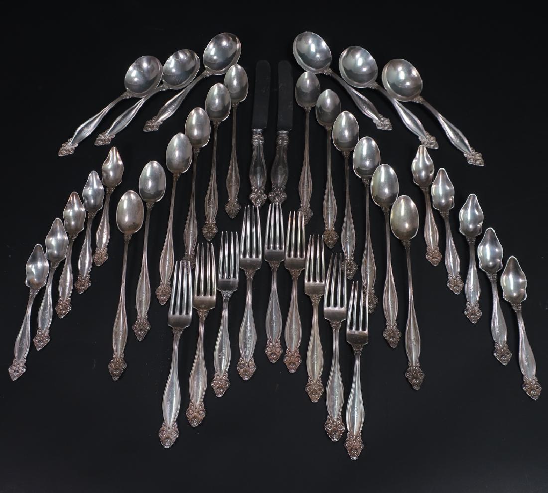 Partial Sterling Flatware Set "Jeanne D'Arc": Partial Sterling Flatware Set, Made by International Silver Co., "Jeanne D'Arc" 1905, including 6 round bowl soups, 10 citrus spoons, 12 ice tea spoons, 9 forks, and 2 knives. Total Weight 49.8 ozt. (