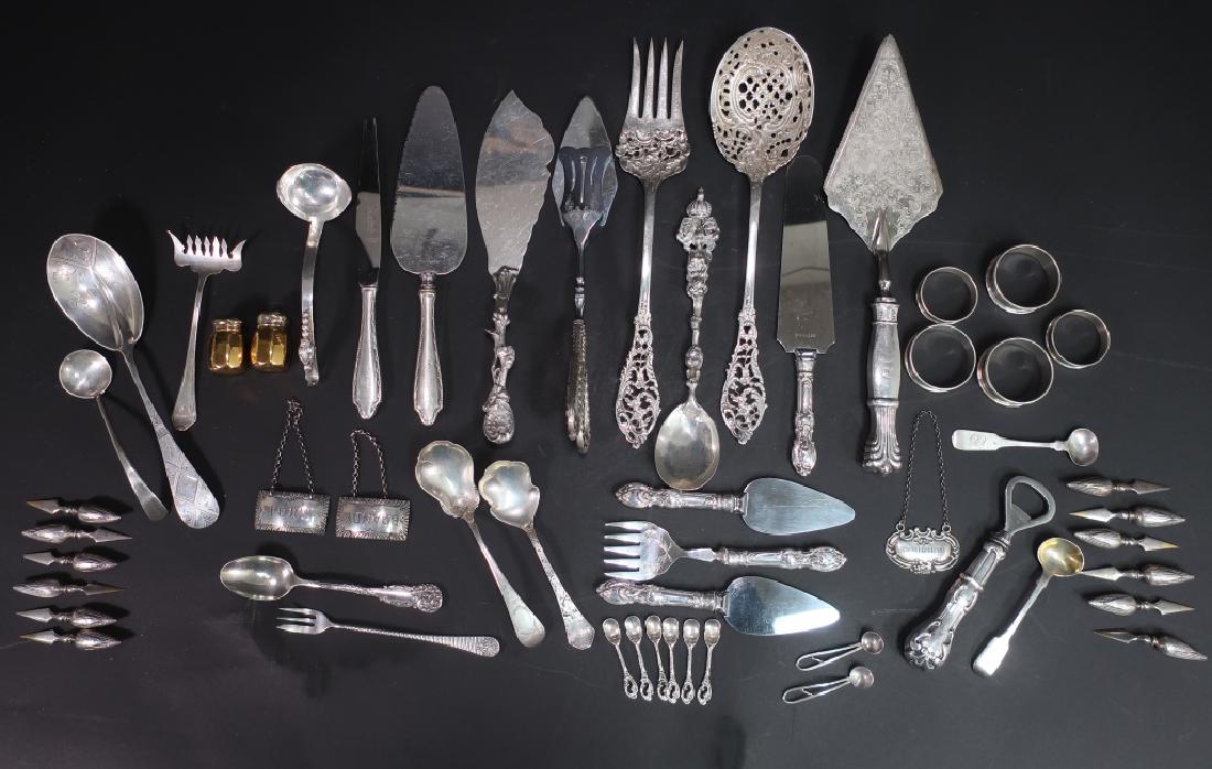 Sterling and Coin Silver Flatware: Sterling and Coin Silver Flatware, Includes napkin rings, liquor tags, ladles, spoons, sardine forks, etc. Also sterling handled corn holders, tongs, barware and serving pieces, various makers. Total 