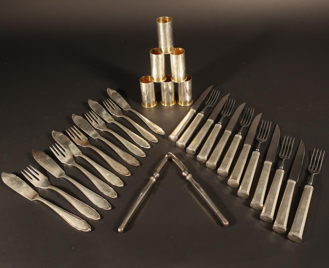 .800 Silver Fish Set and Other Items: .800 Silver Fish Set and Other Items, including: (6) .800 schnapps cups in the form of shot gun shells; (6) .800 fish knives and (5) .800 fish forks. Also included are (6) .813 handled knives and (6) 