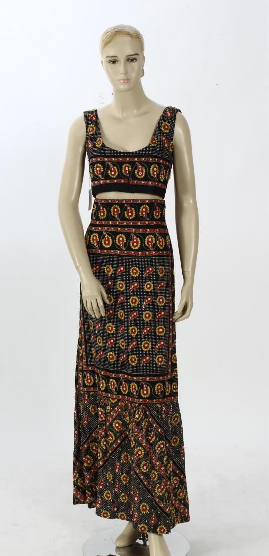 Hand Beaded Paisley Skirt and Top: Skirt and matching top with red and yellow paisley design with beads and sequins. High waist, back zip, slightly ruffled bottom and midriff top with scoop neck and hook & eye closure back - lined.(MAL