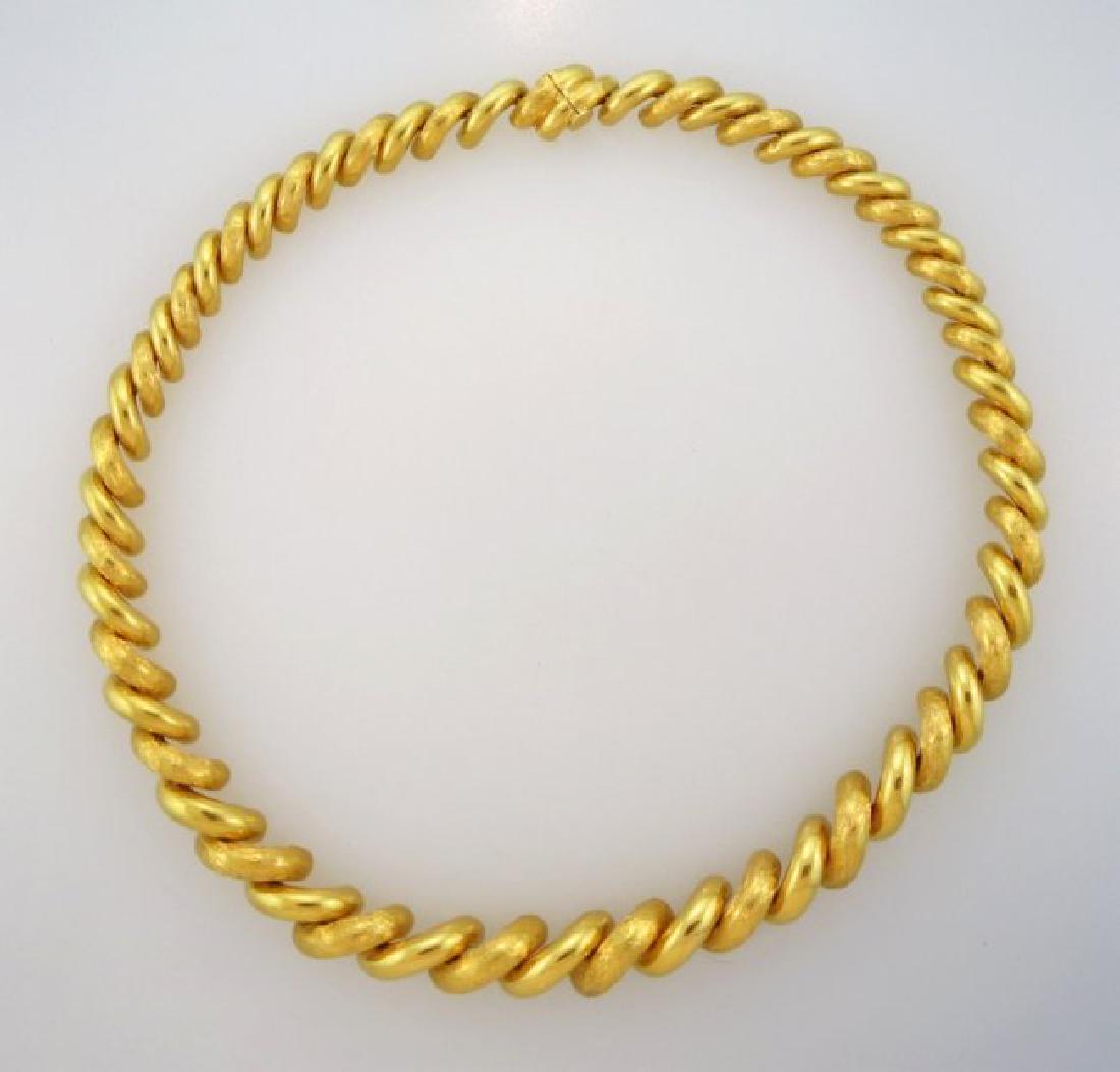 18k Gold Link Choker: Composed of tapered interlocking curb links. Approximately 69.5 grams. NOTE: All jewelry must be paid for by wire transfer or cash -- no exceptions.(JMAR7509)(WT)Dimensions: 17.5" long