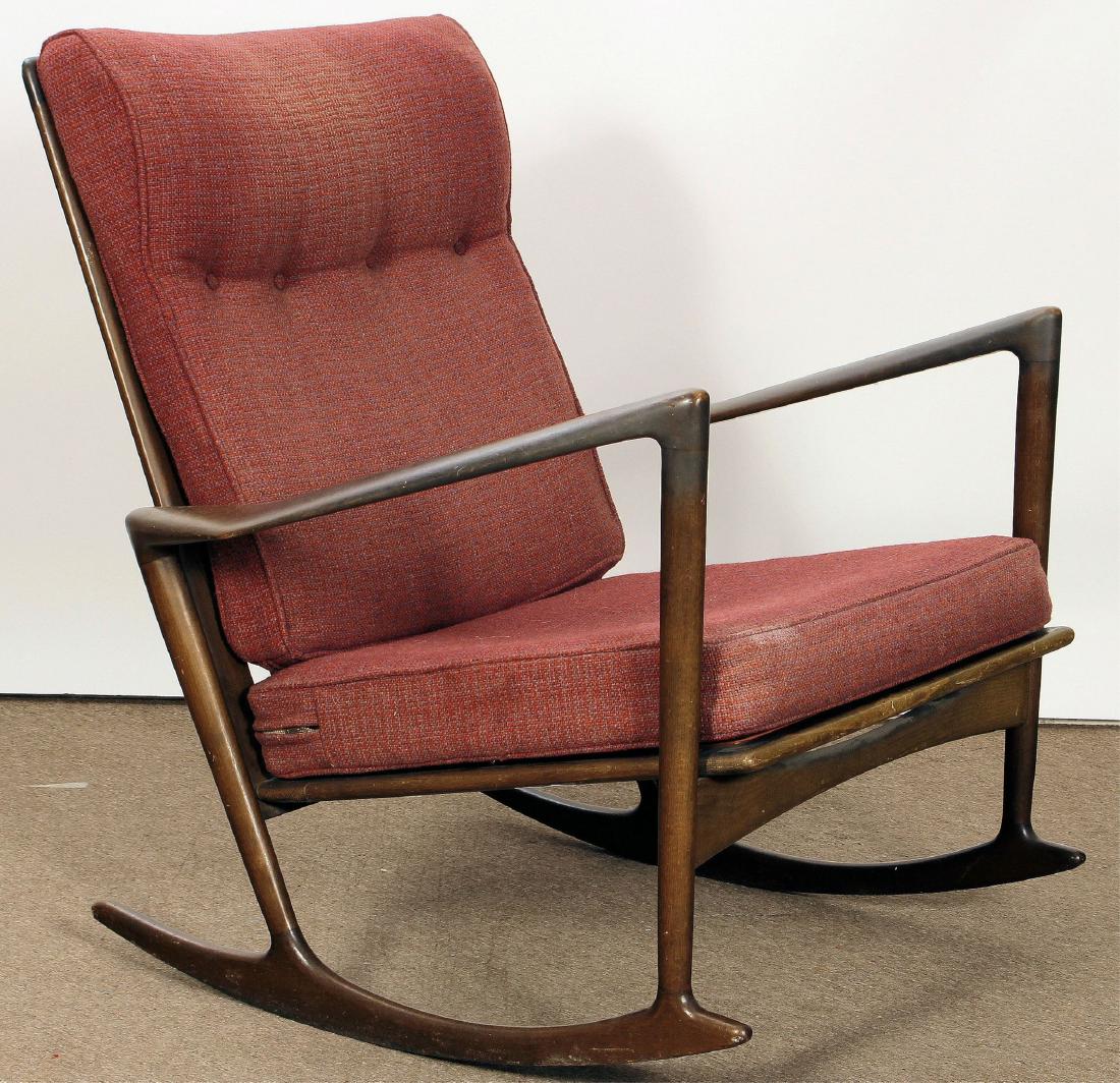 IB Kofod-Larsen Rocking Chair for Selig, c. 1960: IB Kofod-Larsen Rocking Chair for Selig, Denmark, c. 1960's, sculpted beech with walnut stain, bears metal Selig Denmark tag [ROSE7347] (NHT) Dimensions: 35.5" H x 32" W Provenance: From an Upper West