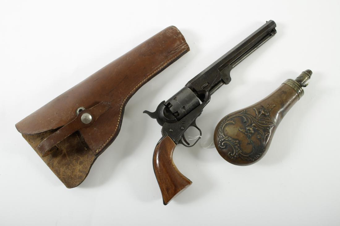 Colt Style "Dragoon" Sidearm And a Powder Flask: Percussion type revolver. Possible "theatrical property" or model as not operable in current set up: blocked barrel and cylinder. Six round cylinder. Two sided wood grip. Octagonal barrel. Similar to 