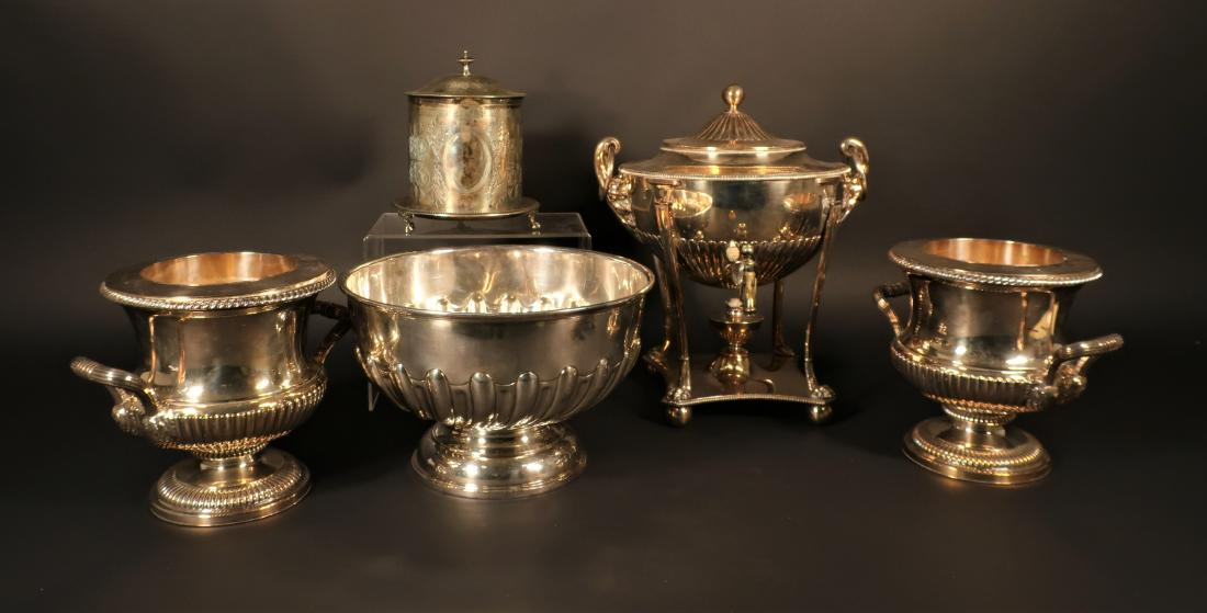 5 Pieces of Silver Plate; Antique & More Recent: Comprises: hot water urn, pair of wine coolers, biscuit box, and punch bowl. (EPEN1515/5) (WT) Dimensions: Urn: 15" x 12" Coolers: 8.5" x 10" Bowl: 8" x 12"