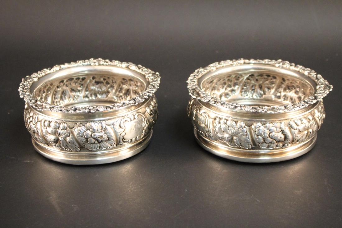 Pair of English Repousse Sterling Wine Coasters: Pair of English Repousse Sterling Wine Coasters, marks assumed rubbed (MIKA1011/2) (TC) Dimensions: 6.25 diameter, 3" H
