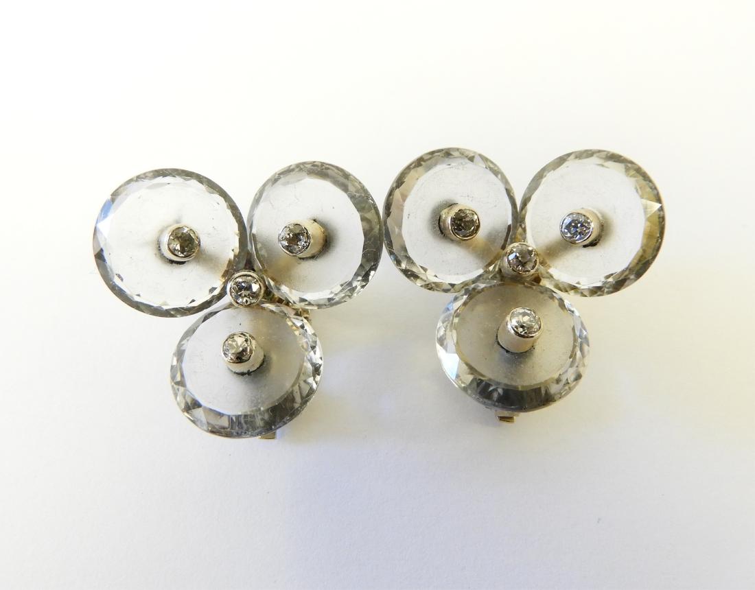 14k and Diamond Earrings: Featuring four bezel set diamonds on frosted glass discs. Marked 14k along with a patent number. 12 gross grams. (LCA1387) (EL) NOTE: All jewelry lots must be paid by wire transfer. Dimensions: 1" 