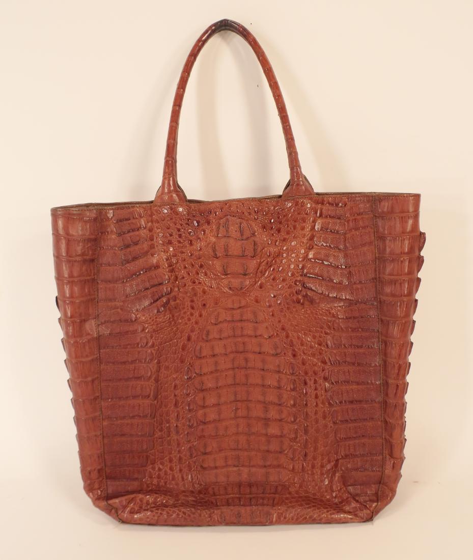 Crocodile Tote by Allez: Brown suede interior with zip and slip pockets. Magnetic tab closure and double handles. (RBERG) (KR) Dimensions: 16" x 13" x 5"