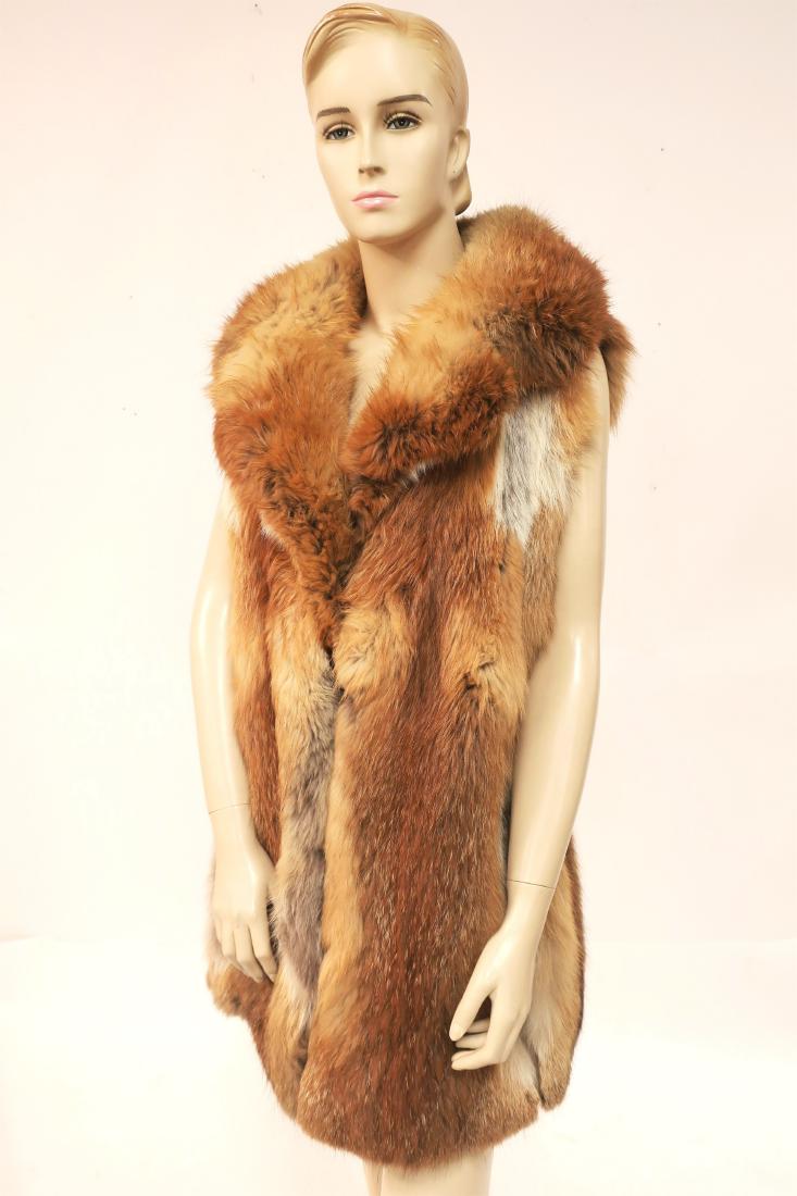 Red Fox Fur Vest by Ruth Ruddy, NY: Notched collar, side slip pockets with brown silk lining. (COOP1308) (KR) Dimensions: Size small/medium. 18" bust, 31" long