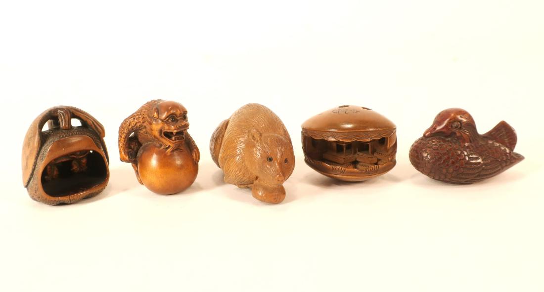 5 Japanese Wood Netsuke: Comprising: rat, duck, figures inside a fruit, clam shell diorama with buildings and figures and a monster atop a ball; the clam and monster signed. [r. 35, 37, 38, 39, 43] (HINC1522/5) (WT) Dimension