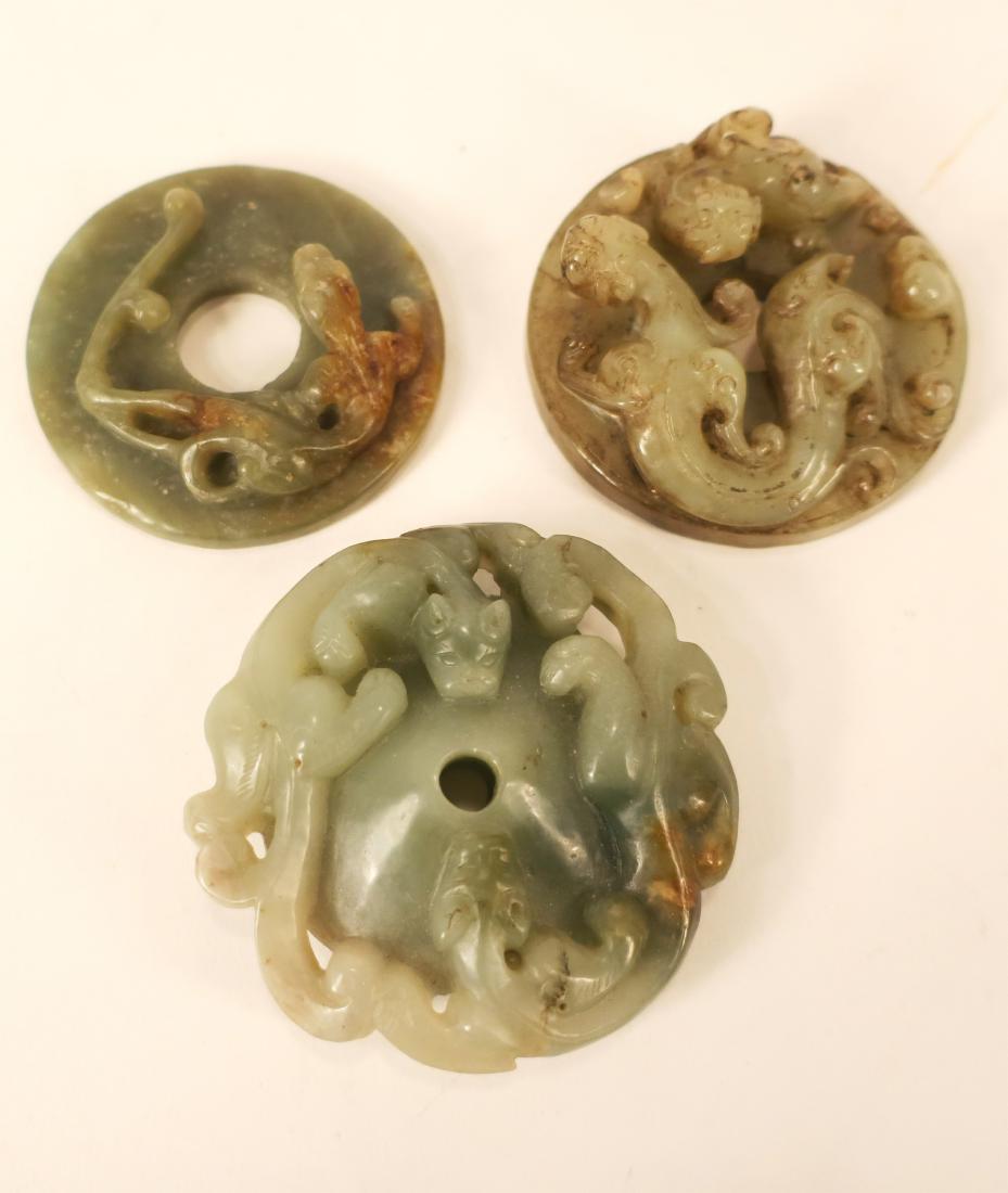 3 Chinese Greenish/Gray Carved Discs: Carved with serpents, foo dogs, tigers and lizards [r. 18, 23, 29] (HINC1506/3) (WT) Dimensions: 2 1/4" to 2 1/2" Dia.