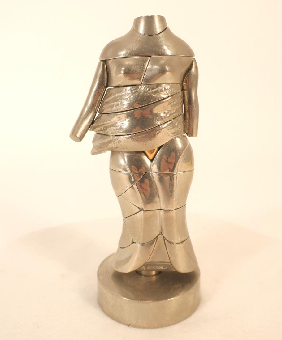 Miguel Berrocal 1933-2006 Mini Cariátide Sculpture: Miguel Berrocal Spanish 1933-2006 Mini Cariátide Puzzle Sculpture, mid-70's, chromed and bright bronze, signed and numbered (JGLO1018) (TC) Dimensions: 5 7/8 x 2 3/4 x 1 5/8 in