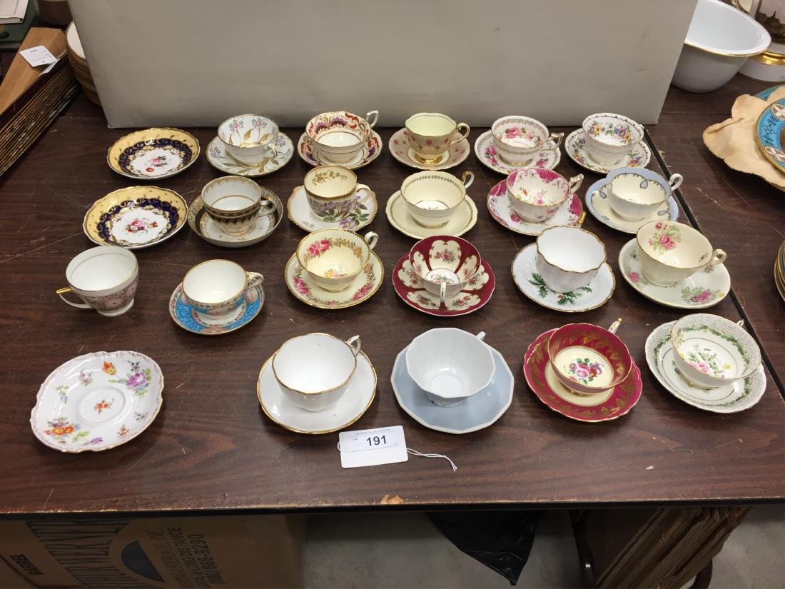Minton Porcelain Cup and Saucer: With Pate sur Pate and Putti decoration along with 18 other cups and saucers, 3 odd saucers and one odd cup Dimensions: Standard Sizes (EPEN25-191/23) (WT)