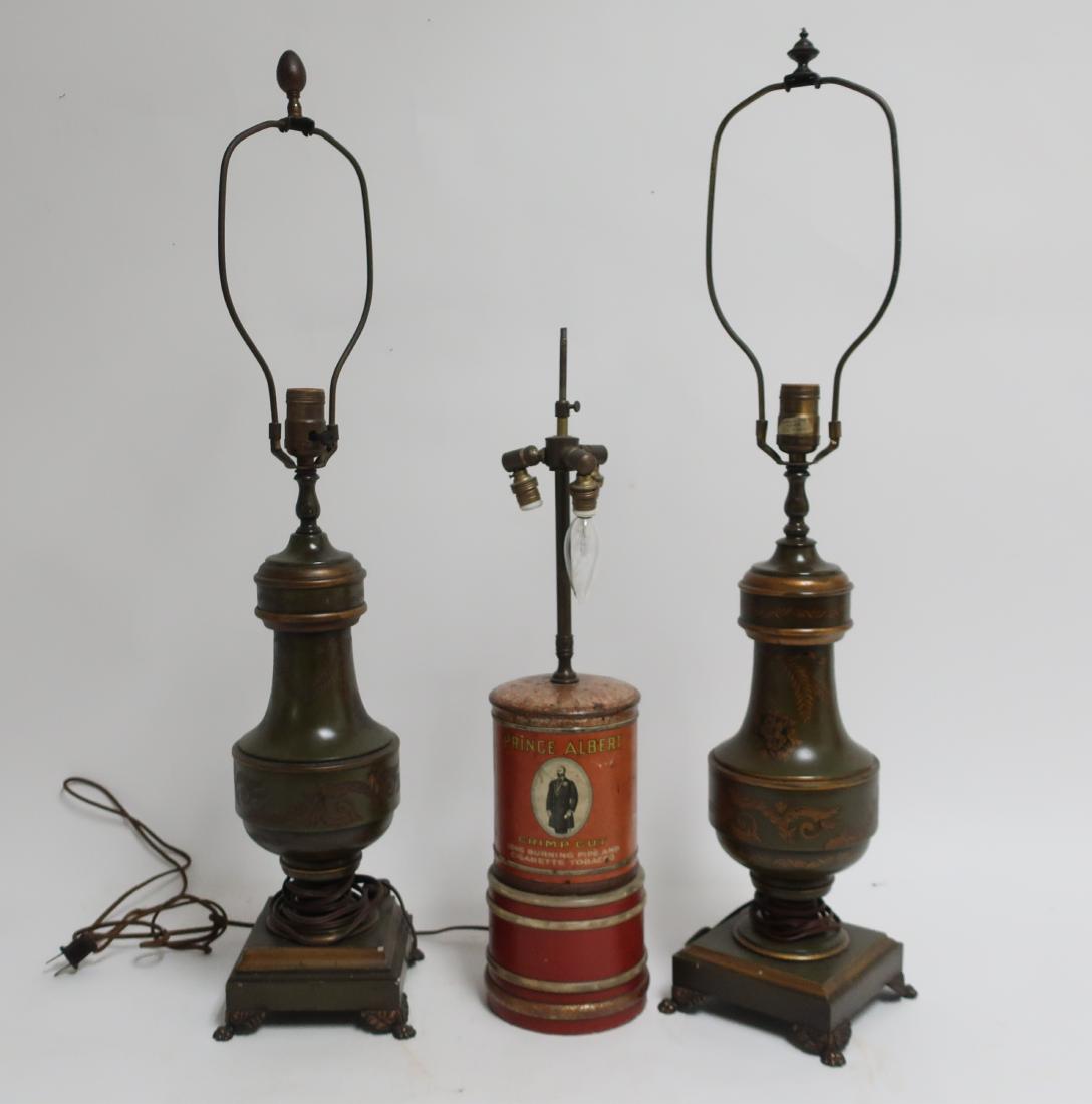 Near Pr. Frederick Cooper Tole Lamps and P.A. Lamp: F.C. lamps columnar form,square bases, slightly different base profiles to each lamp; bronzed metal feet. Prince Albert Tobacco can lamp, painted to match wood base; three socket fixture' switch on ba
