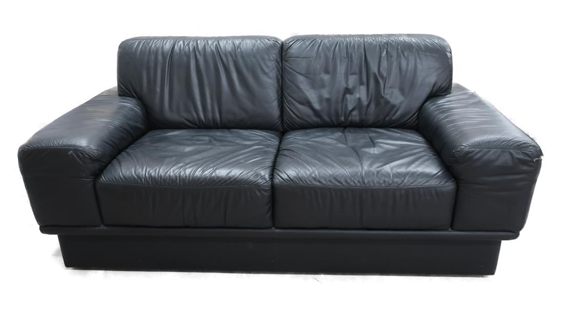 Italian Black Top Grain Leather Loveseat, c. 1980: Italian Black Top Grain Leather Loveseat, c. 1980, purchased in Miami. NOTE: part of a matching suite of Italian leather elsewhere in this auction Dimensions: 68" W x 34" D x 31" H (MGLA1006) (TC)