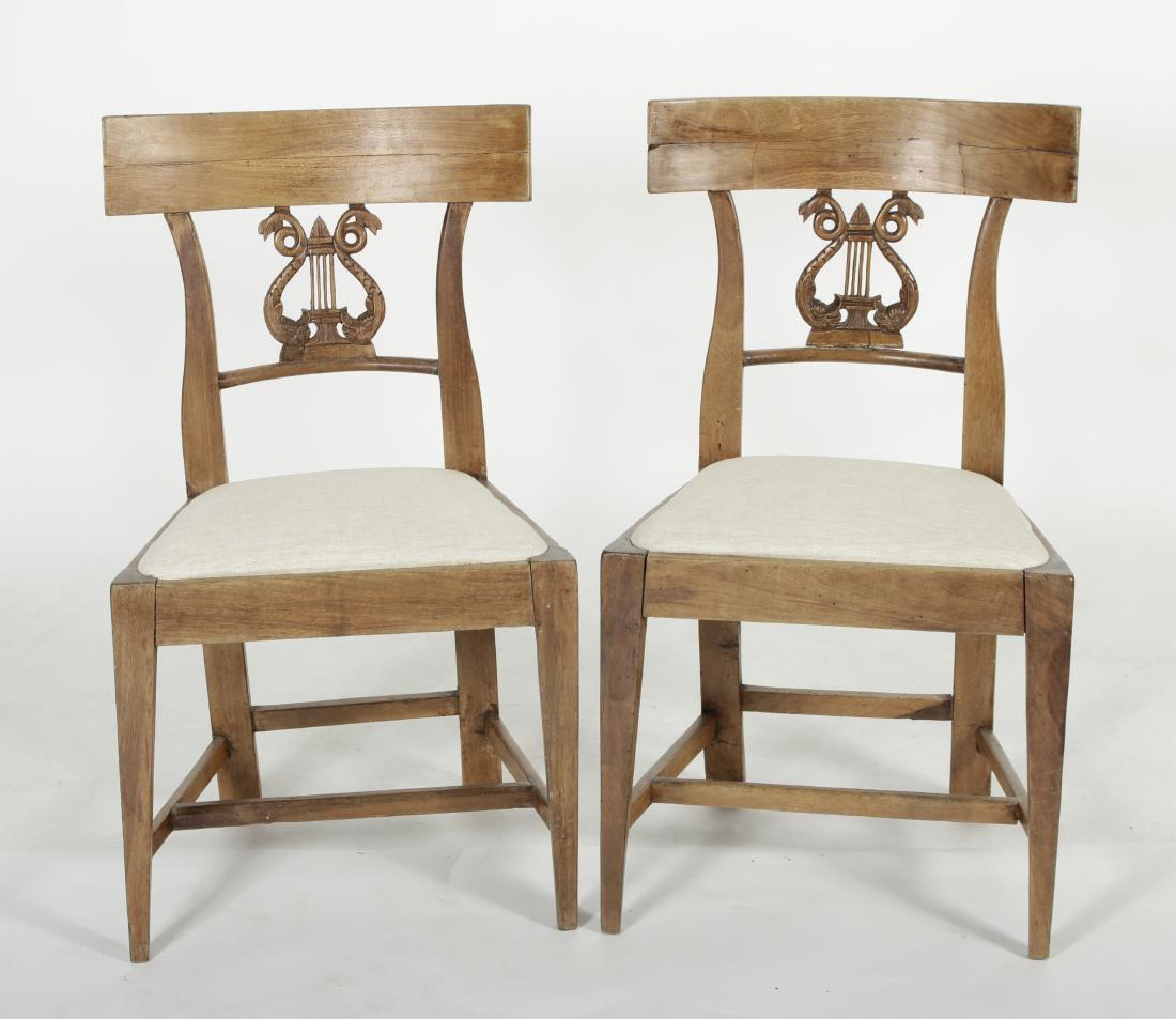 Pr. of Walnut Carved Lyre Back Side Chairs: Pr. of Duncan Phyfe Style Walnut Dolphin Carved Lyre Back Side Chairs,19th C., possibly Italian, newly upholstered seats Dimensions: 33 x 19 x 19 (TWAL369/2) (MM)