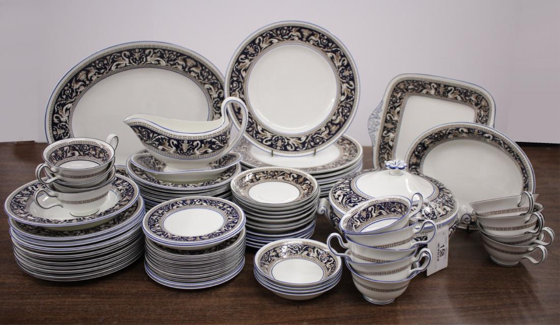 Wedgwood Porcelain Dinner Service: Florentine pattern, mix of blue and white background, Comprising: 12 dinner plates; 12 soup plates; 12 luncheon plates; 13 teacups and saucers; 12 butter plates; 4 small dessert dishes; covered vegeta