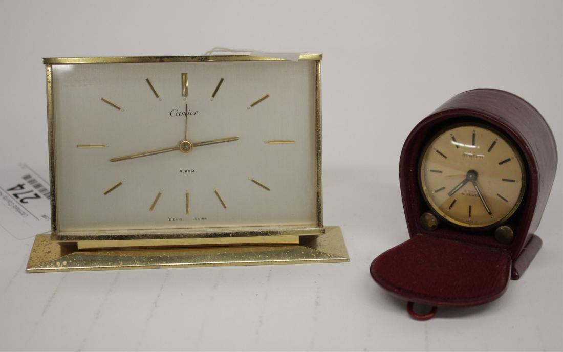 Two Alarm Clocks: Cartier and Gubelin: Both 8 Day, Swiss made. Cartier has rectangular case w/ base platform. As-is as not in working order and not tested for operation/function specifically but not exclusively winding function. Gubelin, r