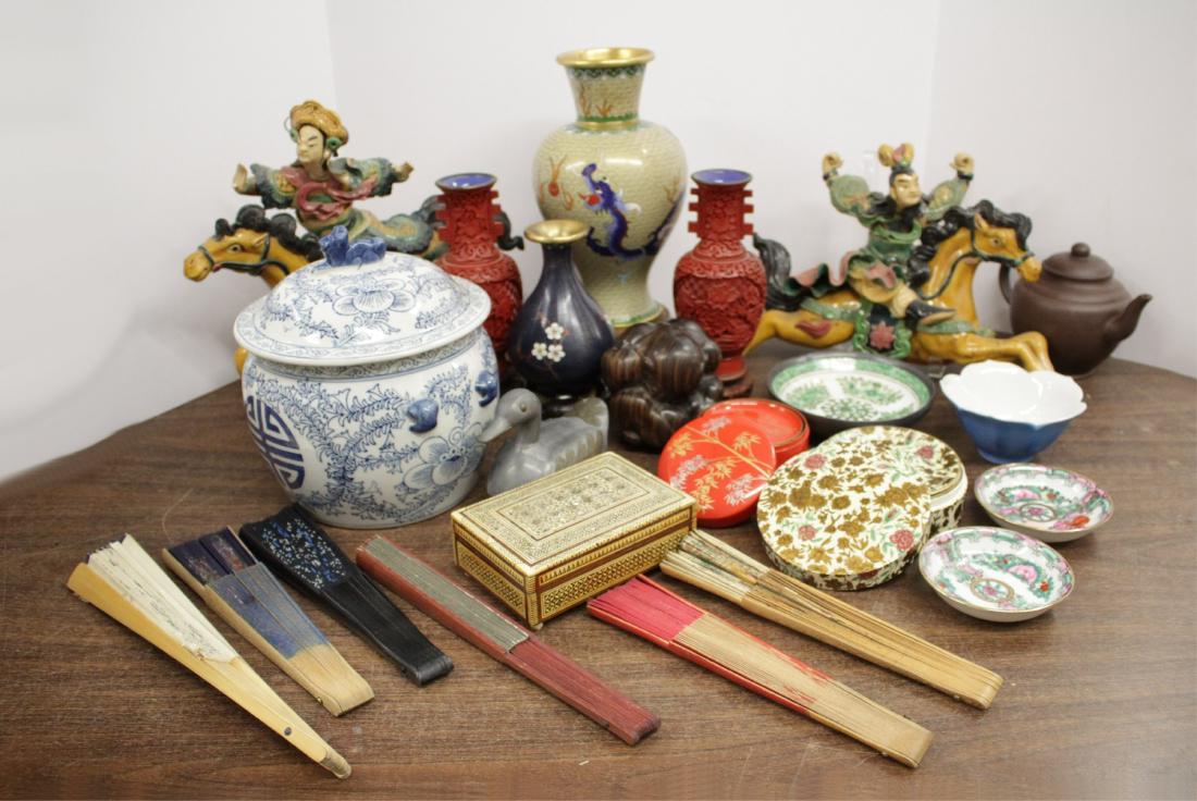 Asian Decorative Lot Approx. 24 Items: Lidded blue and white ceramic jar, cloisonne vases on stands, carved Buddha w/ face in hands, figures on horses wired for hanging, coaster sets (Japan), M.O.P. inlaid box, hand fans, teapot, small dis