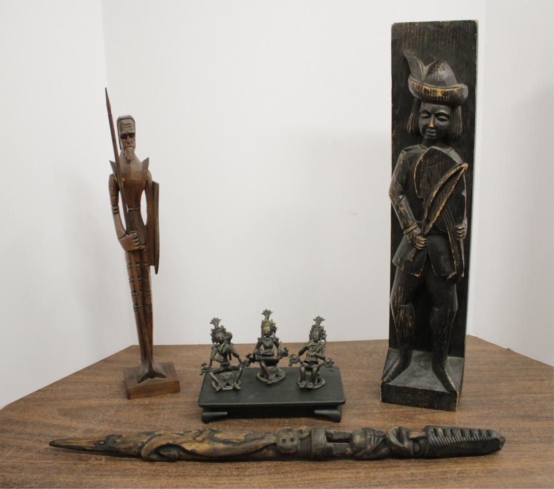 3 Bronze Balinese Style, 3 Carved Wood Figures: Small scale bronze musician figures. Carved wood items: totem w/ figures w/ stake-like point; slender figure w/ spear and shield; minstrel figure w/ string instrument. Small ceramic platform. DIMENSIO