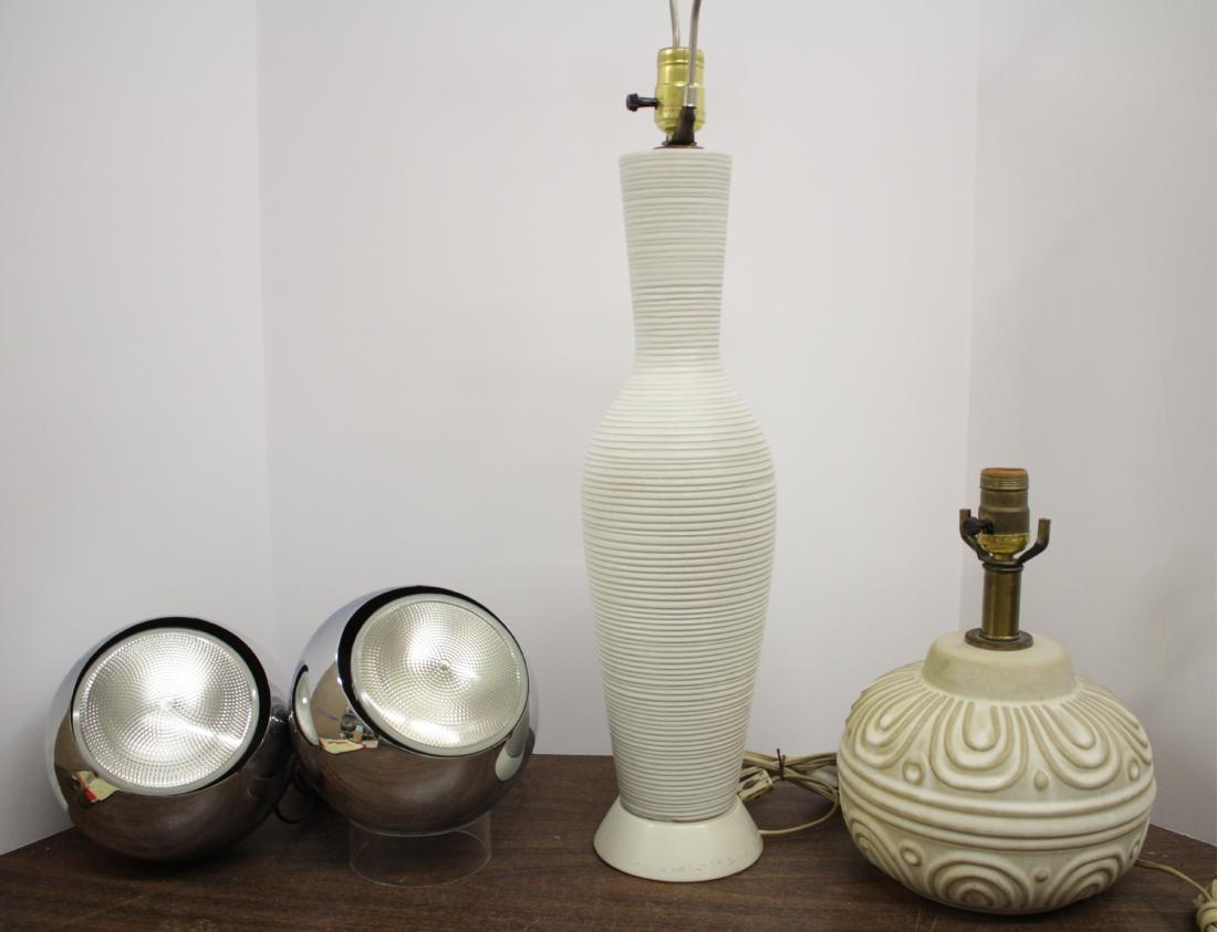 Two Modern Ceramic Lamps, Two Chrome Uplights: A tall, slender long neck vase form, pearl lustre putty color w/ thin light brown highlights to incised, thin horizontal bands; beveled metal base. Second lamp a squat jar form w/ raised design. Pair 