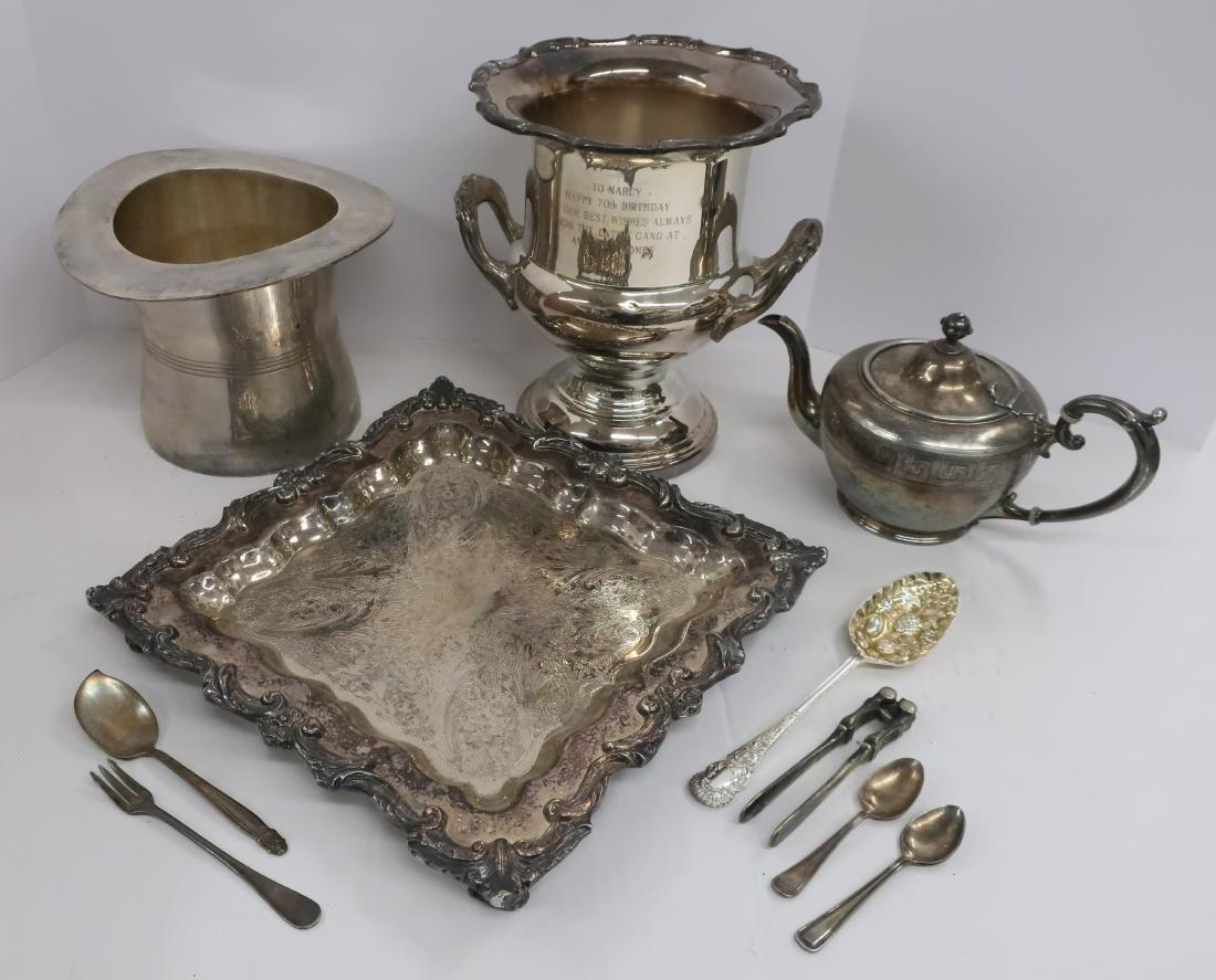 Group of silver plate: Group of silver plate, includes 2-champagne buckets, square tray, teapot and assorted flatware. DIMENSIONS: Various. Tray is 12.5 square. Larger bucket is 10 h. We encourage all bidders to obtain ship