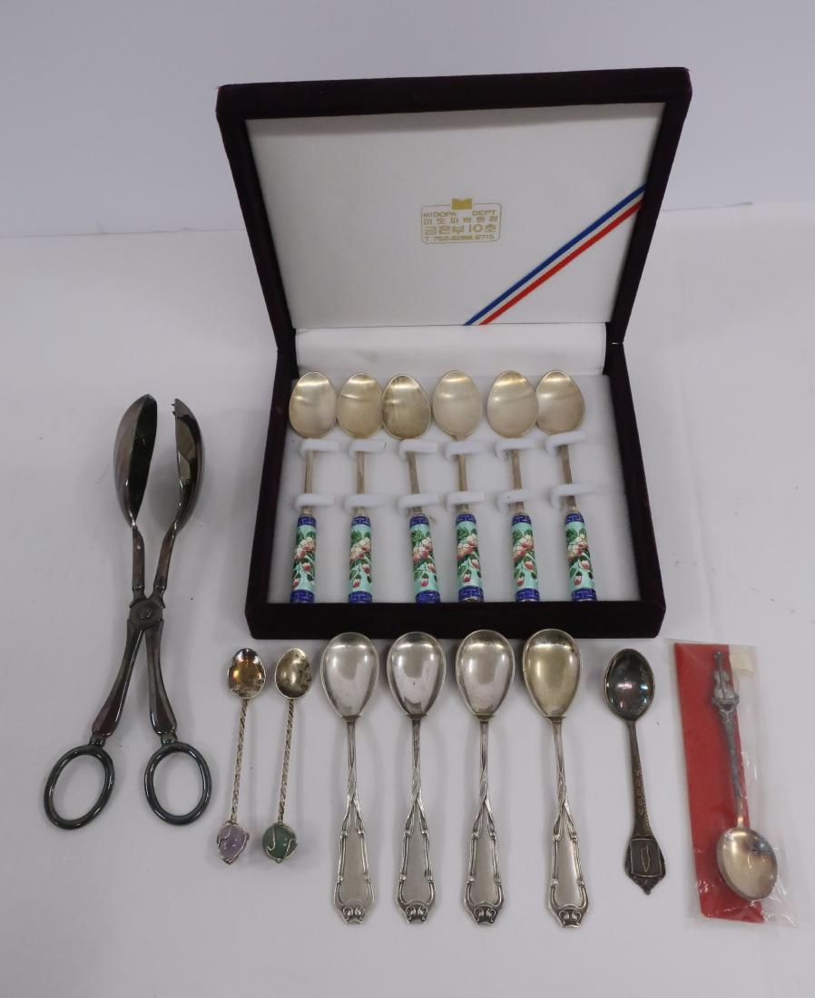 15 Pieces of Silver and Silverplate: Set of 6 Chinese Enamel & Silver Spoons, four .800 silver spoons, and various small silver and silver plate souvenir and other spoons & a silver plate tongs. (15 pcs) DIMENSIONS: Chinese spoons: 5.5" 