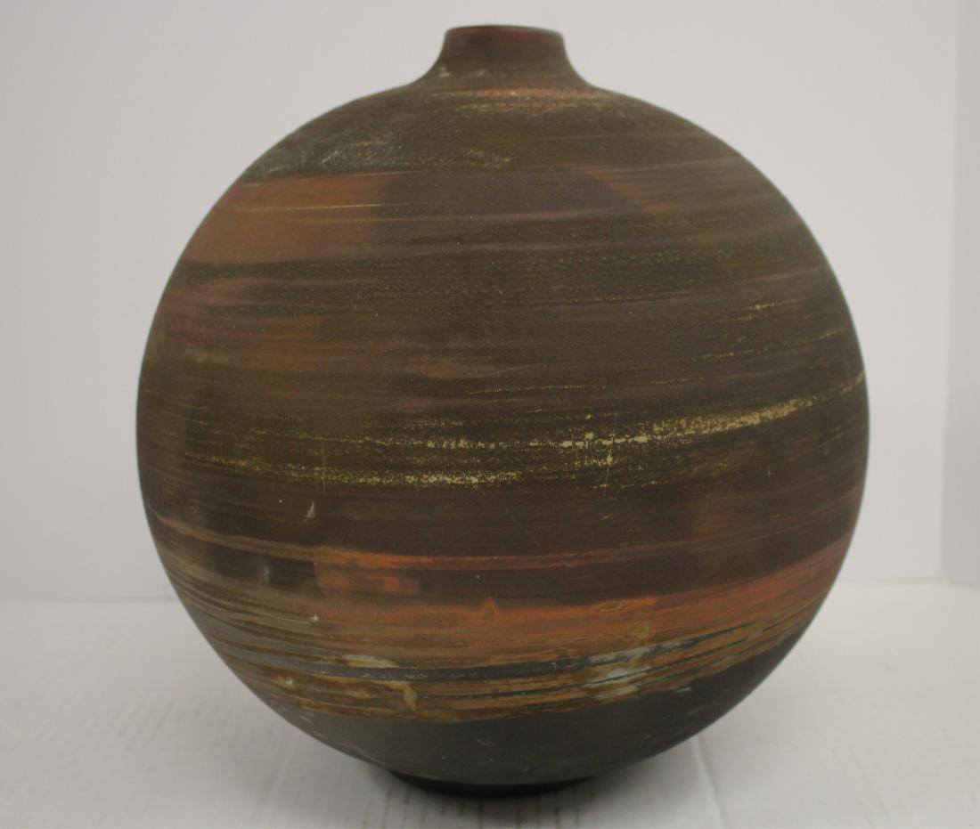 Modern Raku Vessel by Jonathan Pressler: Globular form. Soft texture feel surface, matte finish. Horizontal bands of muted earth colors, charcoal black to lower form. DIMENSIONS: 13"H. 1.75 opening. We encourage all bidders to obtain shippin