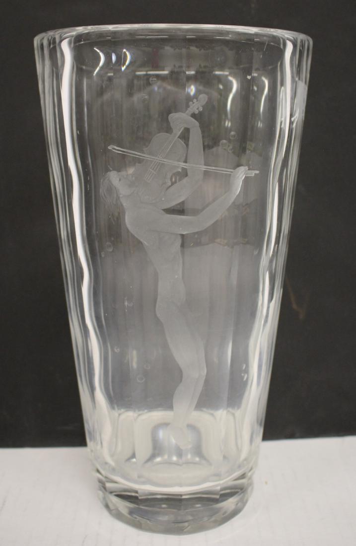 Orrefors Tall Clear Glass Vase: Orrefors Tall Clear Glass Vase, etched with standing violin player. #2827 B7KP, faceted sides. DIMENSIONS: 11.5 h by 6 diam. We encourage all bidders to obtain shipping quotes before placing bids. (QA