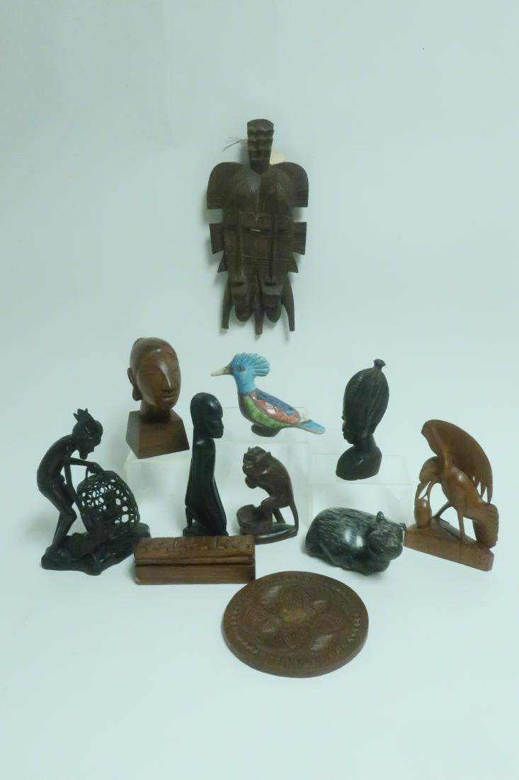 11 Mostly Indonesian/African Wooden Carved Objects: 11 Mostly Indonesian/African Carved Objects, includes African Double Senufo mask, wooden box, trivet,stone Hippo, painted earthenware bird, most signed DIMENSIONS: 6-10"H We encourage all bidders to