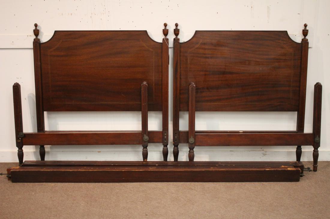 Pair of Federal Style Mahogany Twin Beds: Pair of Federal Style Mahogany Twin Beds with Urn finials and rails DIMENSIONS: 41"h x 36"w x 80"l We encourage all bidders to obtain shipping quotes before placing bids. (QGMAL25-431) (WT)