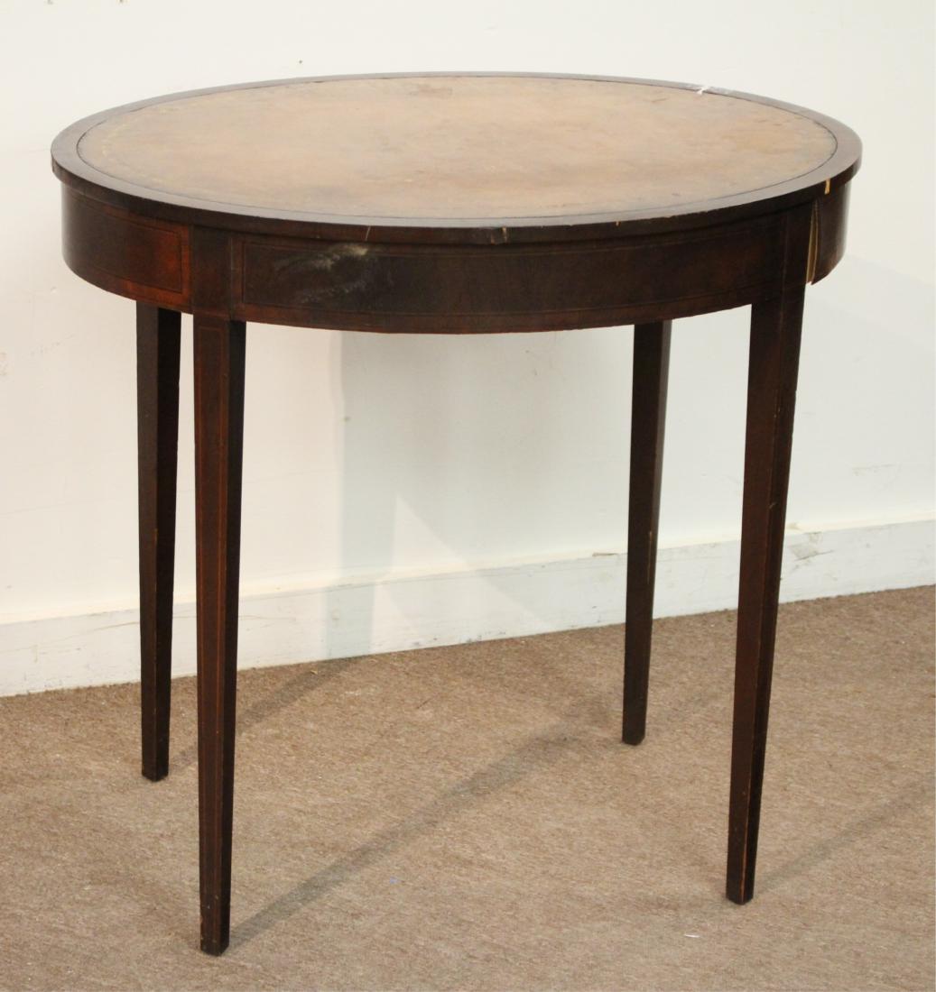 Flint and Horner Oval Table: Flint and Horner Oval Table, inlaid mahogany, leather top DIMENSIONS: 27"h x 28"w We encourage all bidders to obtain shipping quotes before placing bids. (QGMAL25-440) (WT)