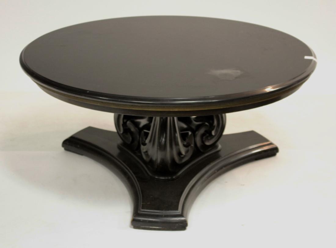 Circular Black Lacquered Coffee Table: Metal banded edge, scroll support DIMENSIONS: 17" H x 38 1/2" Dia. We encourage all bidders to obtain shipping quotes before placing bids. (SAP45-17) (WT)