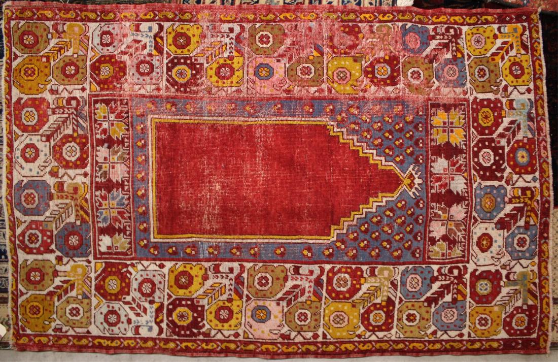 Turkish Prayer Rug, Early 20th C.: Red prayer niche, large borders with geometric flowers DIMENSIONS: 3' 5" x 5' 6" We encourage all bidders to obtain shipping quotes before placing bids. (MIKA35-677) (WT)