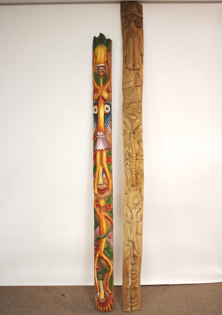 2 Haitian Carved Totems. B. Dyerrier: 2 Haitian Carved Totems. One signed B. Dyerrier and colorfully painted. Both with figures, fruits and flowers. 87' by 7' and 108" by 7"