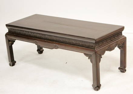 Chinese Hardwood Low Table: Lappet design to frieze, scroll foot. Dimensions: 13 H x 33.5 L x 14 D Property from the Pennell Estate, '4 Winds' in Washington, CT; a family who traces their history in Washington back to the 1930s.