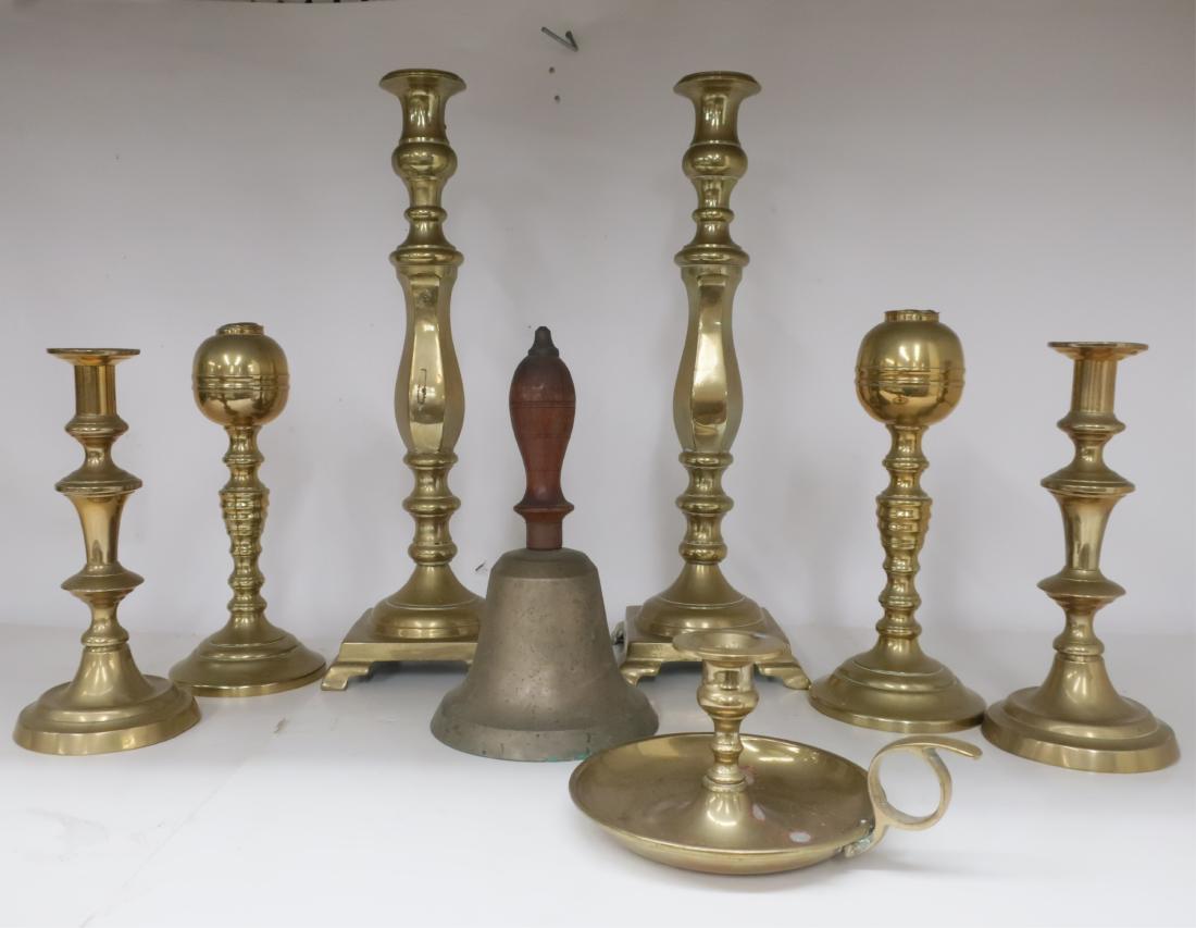 8 Brass Candlesticks and Oil Lamps: Pair of large and heavy sticks, pair oil lamps, chamberstick, pair circular base candlesticks, a school bell. 4 H x 8 W to 17 H x 5.5 sq QWIND7010/8 WT