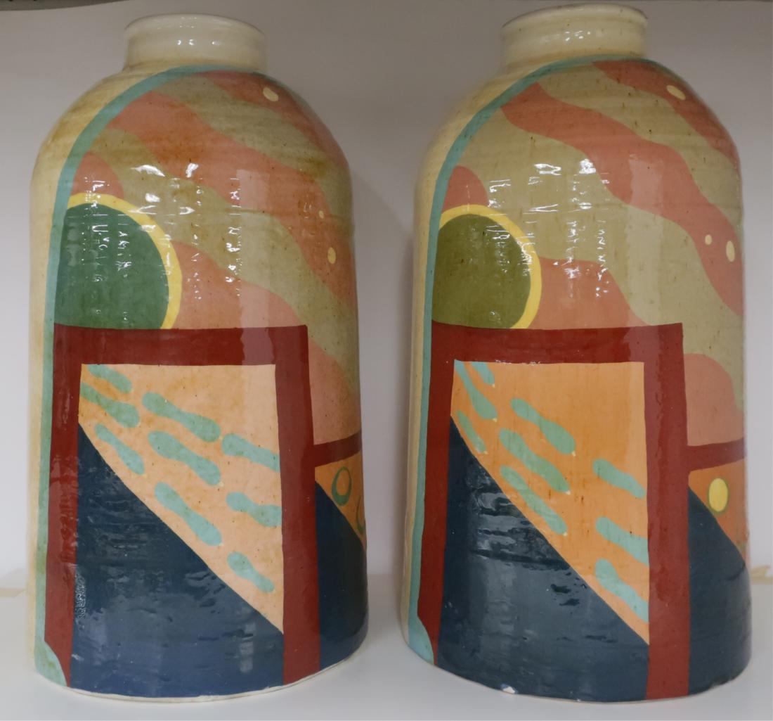 Two Modern Polychrome Pottery Vases/Jars: Near pair, same shapes,abstract geometric designs with some color variations in the design. Signed "Dale 80" on side of one, "Dale & Kristin" bottom of both. Old Saks sticker on bottom of one. 19.5"H