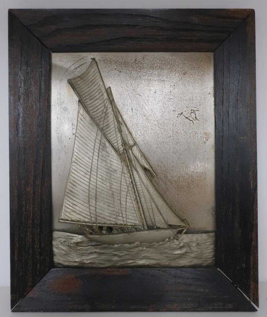 Metal Wall Sculpture "Full Sails": Cast metal sailboat standing off and mounted to galvanized metal panel. (Unseen) bolt & nut holding top to panel. Silvery painted boat, water. Wood frame. Not signed. sight size 10.5" x 8 frame 14.5 x